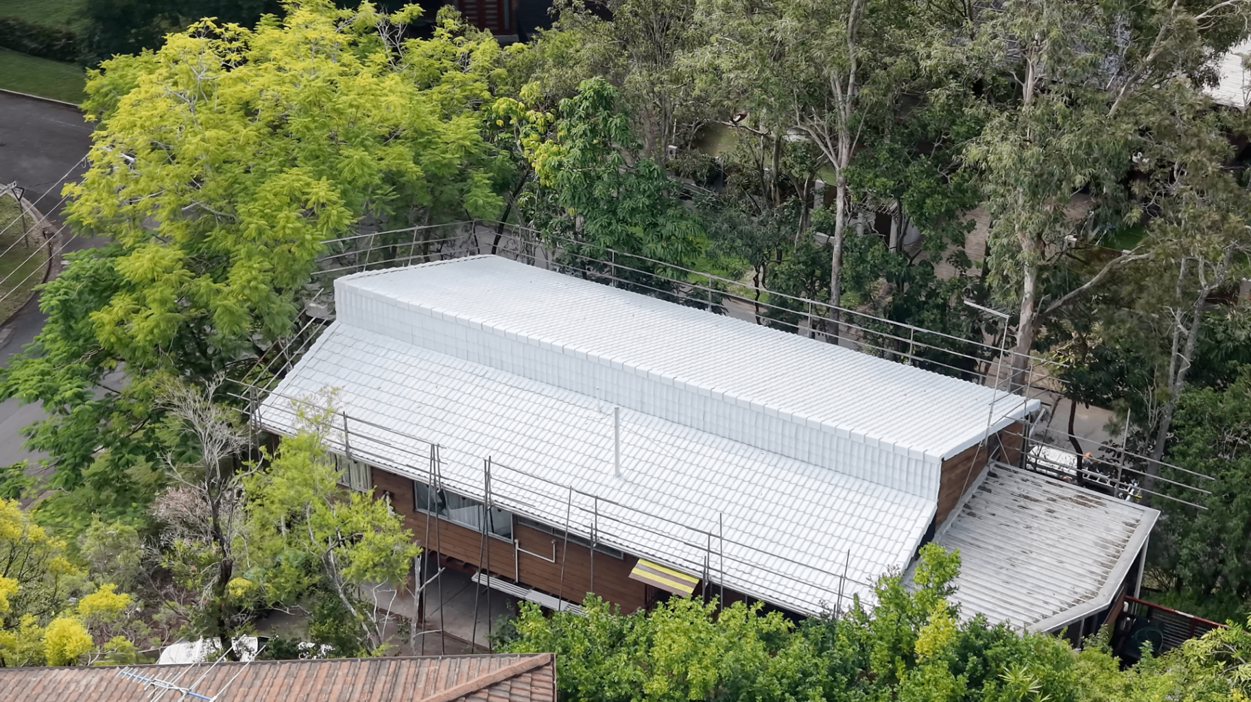 Full tile roof restoration underway on a Brisbane home